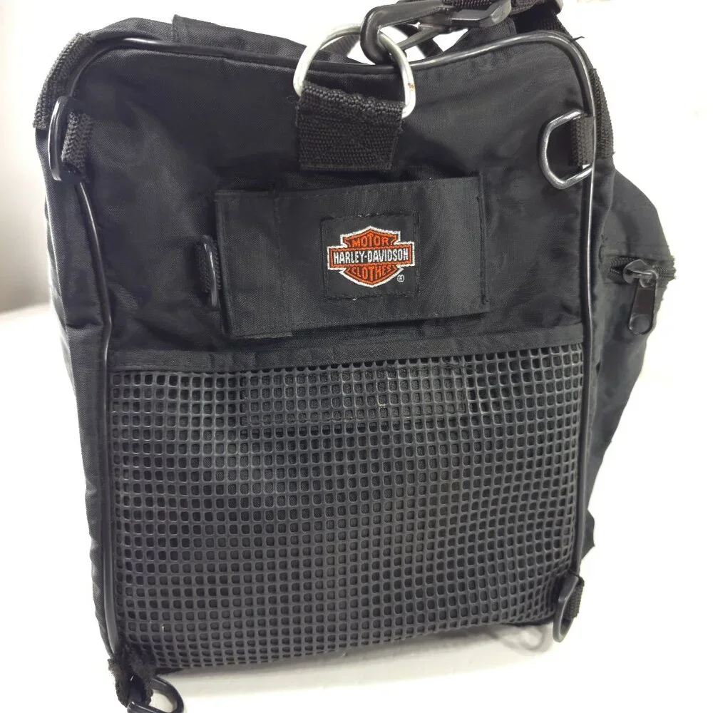 VINTAGE HARLEY DAVIDSON AN AMERICAN LEGEND BLACK DUFFLE BAG WITH SHOULDER STRAP.